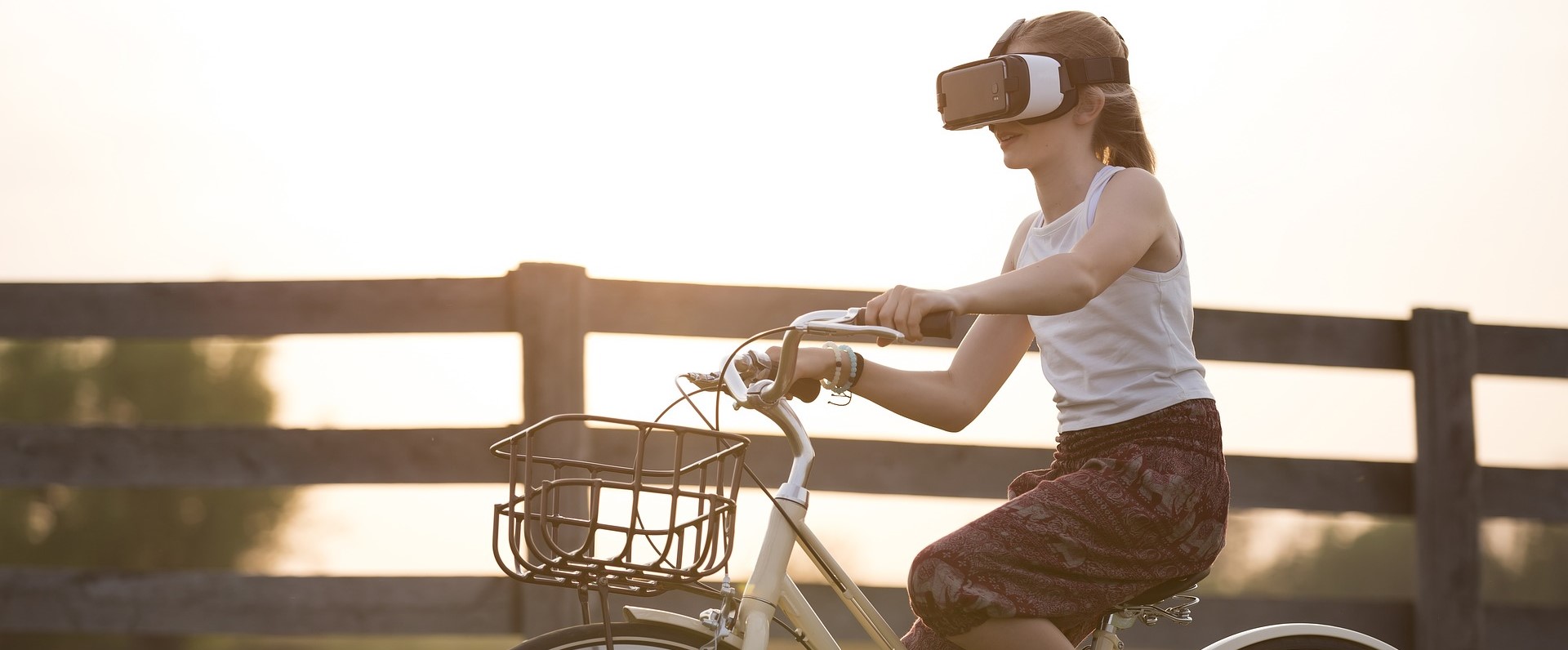 Girl Riding Bike Wearing Virtual Reality Glasses