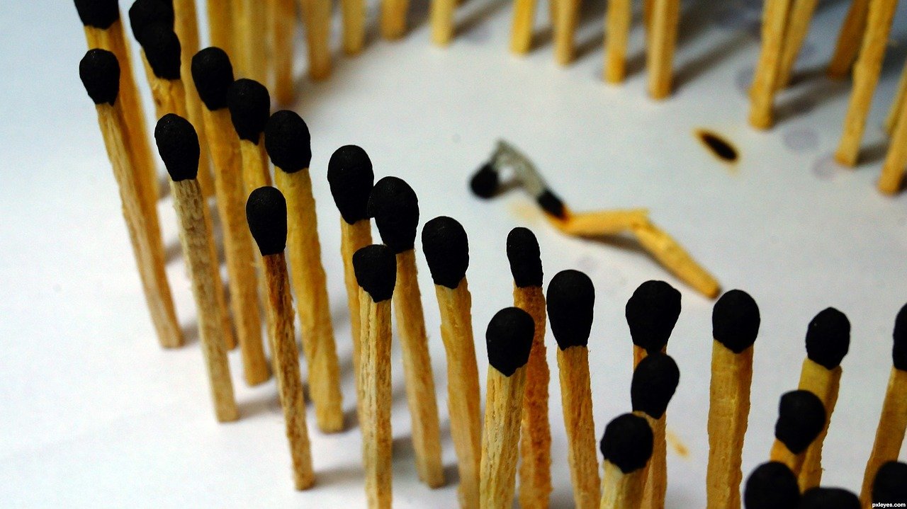 Matches surrounding a burnt out and broken match