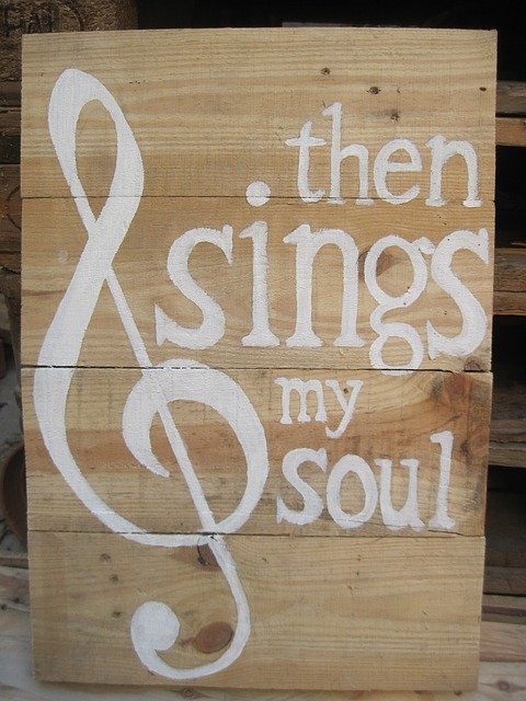 A sign with the phrase "then sings my soul"