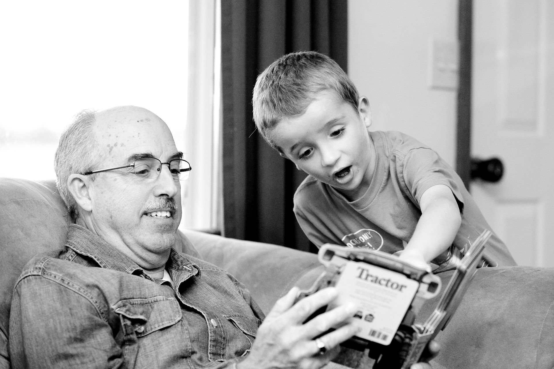 Grandpa and Grandson reading a book