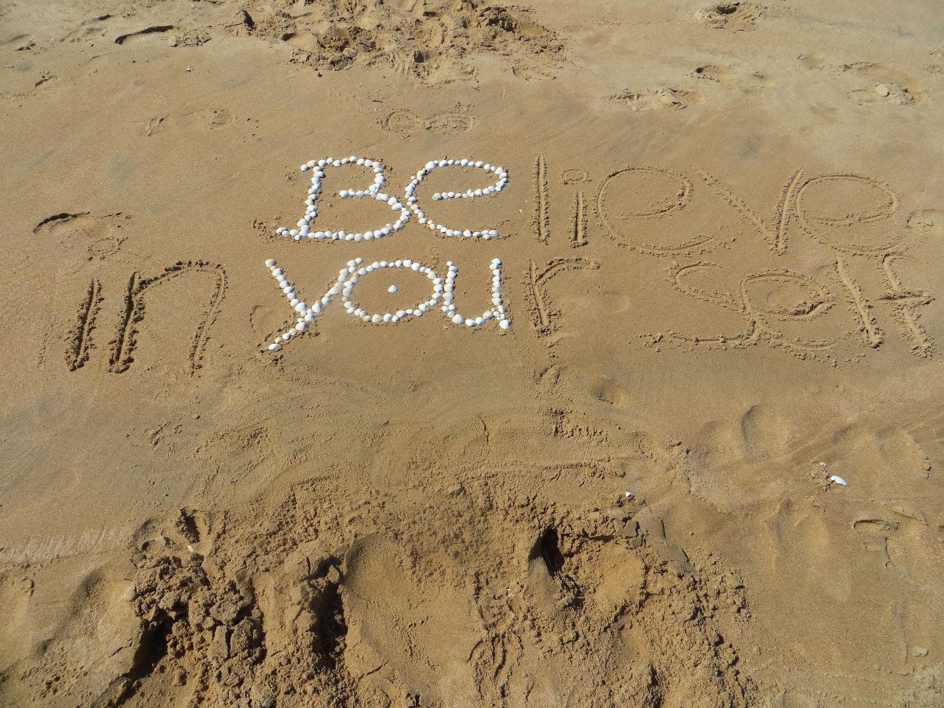 Words on a beach Believe in Yourself