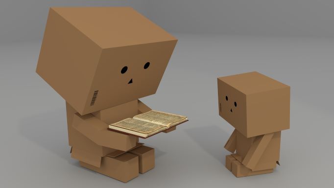 Cardboard adult reading to Cardboard Child