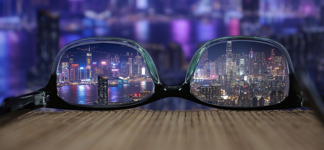 Glasses with a clear view of the night city skylight.