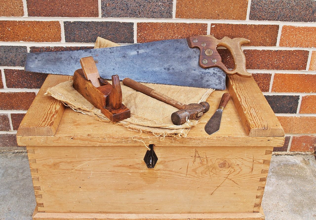 old wooden toolbox with carpenter tools