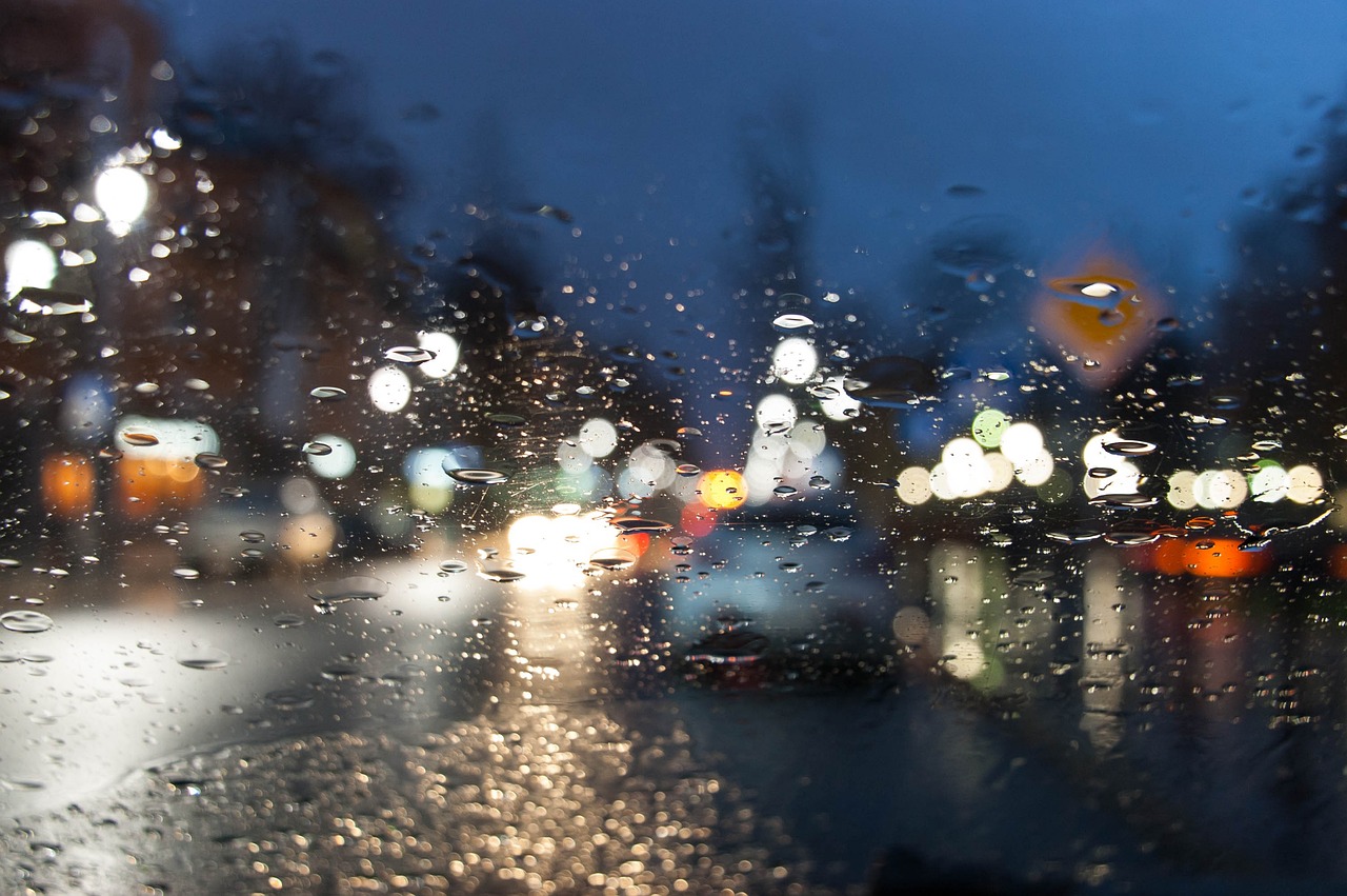 Blurred Window with Rain and lights