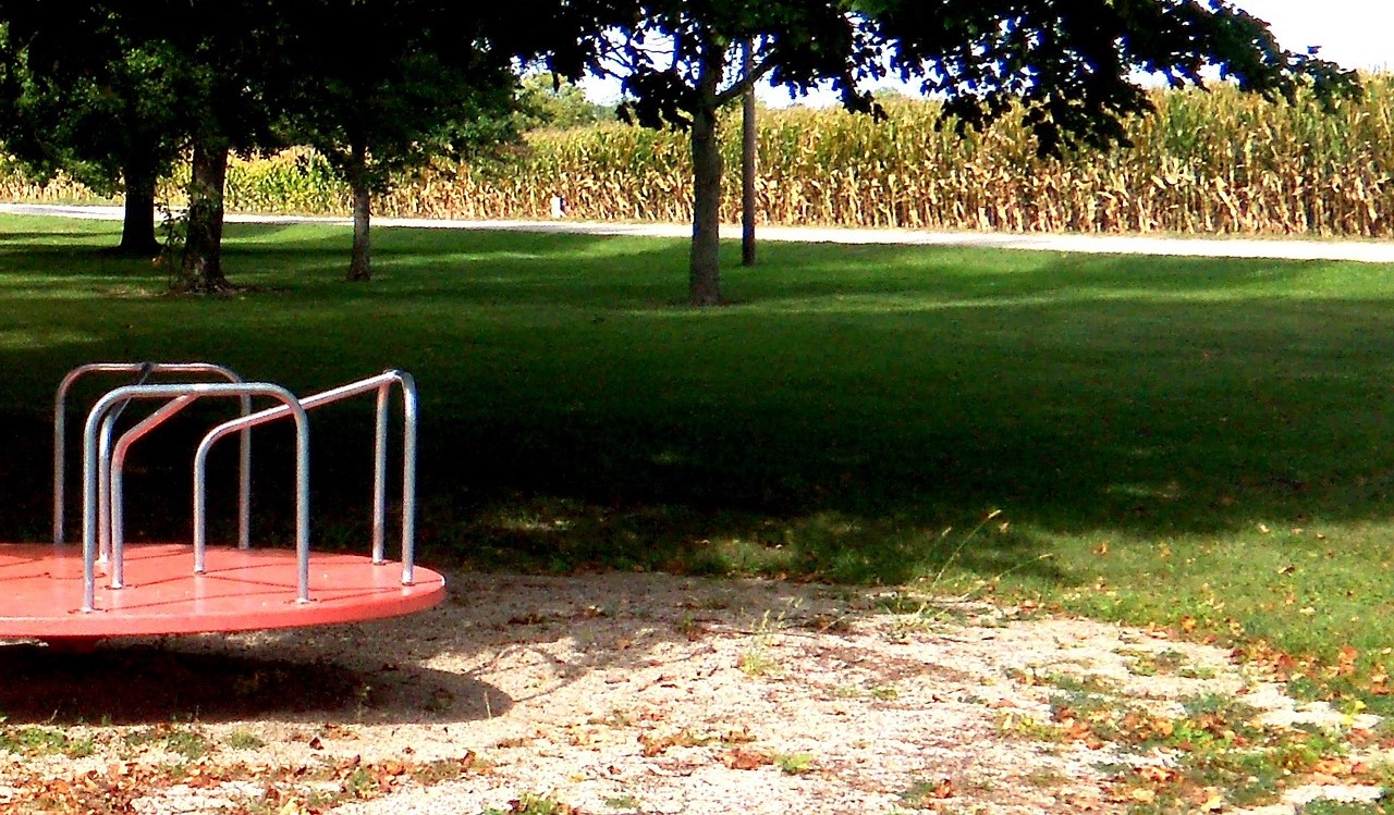 Merry Go Round next to farmland