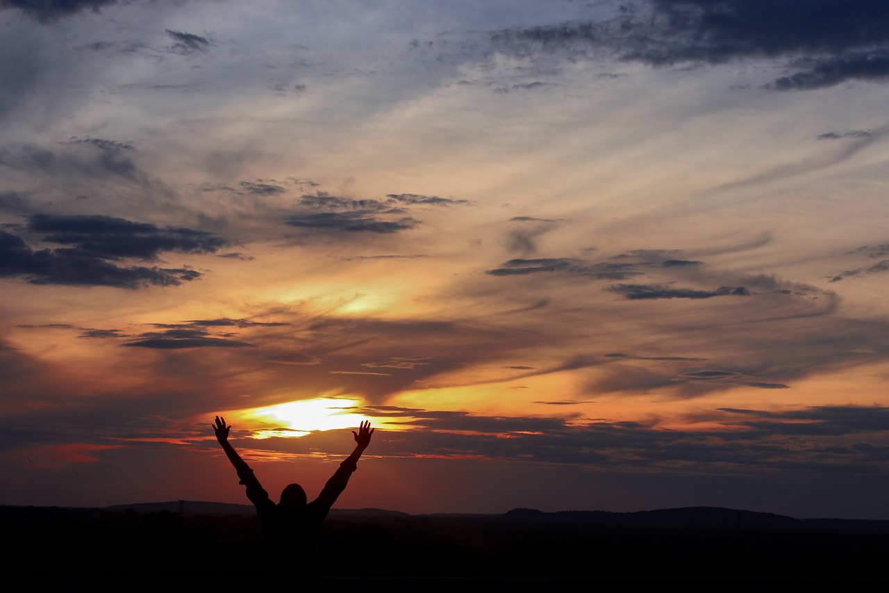 Welcoming the morning sky with thankful hands lifted