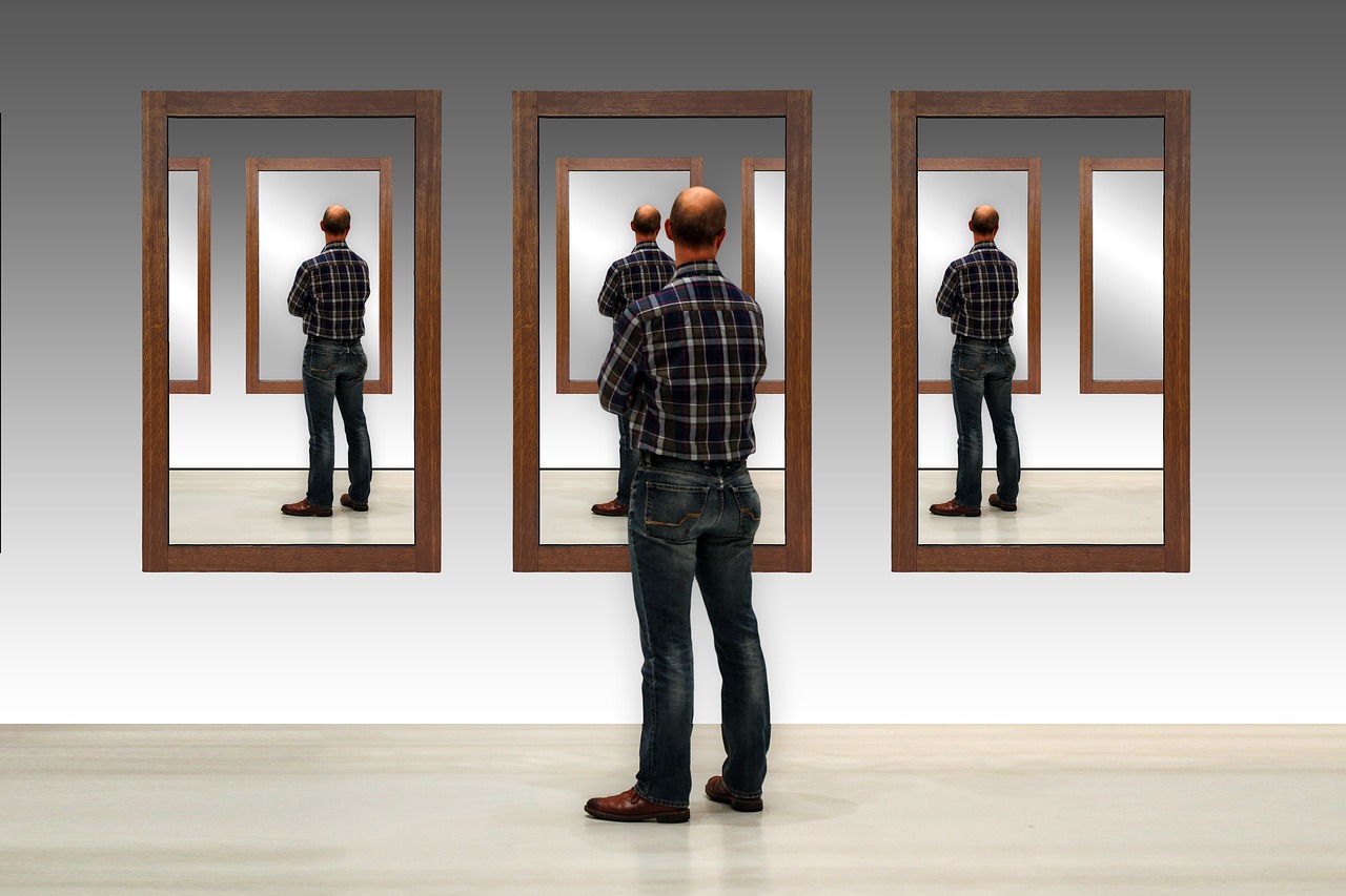 Man seen in three mirrors a constant replrection