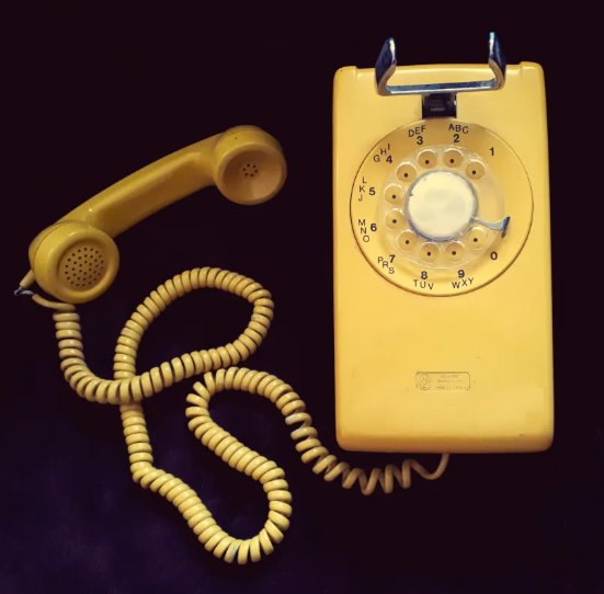 1960s Yellow Rotary Wall Phone